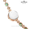 SKYSEED emerald type mother-of-pearl watch